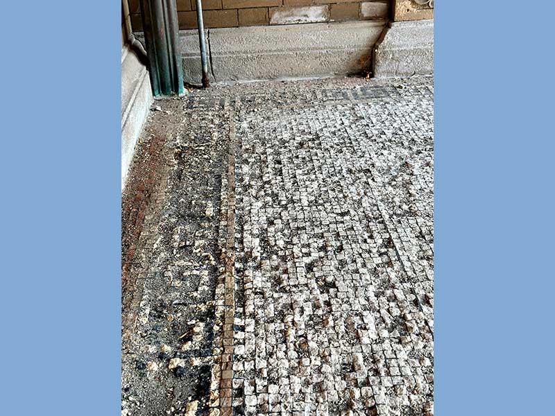 The mosaic tile porch that welcomes visitors will be restored.