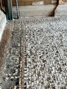 The mosaic tile porch that welcomes visitors will be restored.